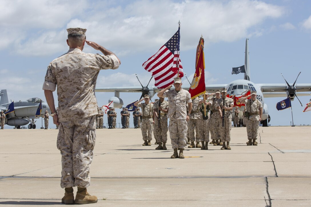 Col. Rick Uribe, former commanding officer of Marine Aircraft Group (MAG) 11, salutes Maj. Gen. Michael Rocco, commanding general of 3rd Marine Aircraft Wing, during a change of command ceremony aboard Marine Corps Air Station Miramar, California, July 10. Uribe assumed command of MAG-11 on July 28, 2013, and will continue his career at Headquarters Marine Corps, Washington, D.C. (U.S. Marine Corps photo by Sgt. Lillian Stephens)