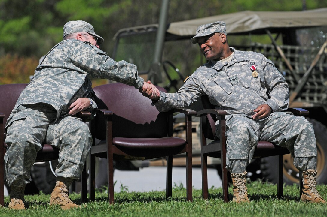 Incoming 415th Chemical, Biological, Radiological, and Nuclear (CBRN) Brigade Commander Col. Michael Maguire (left) and outgoing 415th CBRN Brigade Commander Col. Charles Jones (right) congratulate each other during a change of command ceremony April 11, 2015, in Greenville, S.C. The 415th CBRN Brigade soldiers participated in the change of command ceremony as Jones passed on command to Maguire. (U.S. Army photo by Sgt. Eben Boothby)