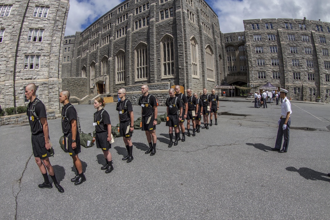 Future cadets arriving at the United States Military Academy at West Point are given an initial class in drill and ceremony by a Cow, or cadet in their third year at the Academy, on R-day. Almost 1,300 future cadets reported to the Academy on R-day, which is typically held on the last Monday in June. After arriving at the Academy, the future cadets are ushered into Thayer Hall where they are fitted for uniforms and processed into the Academy. (U.S. Army photo by Sgt. 1st Class Brian Hamilton)