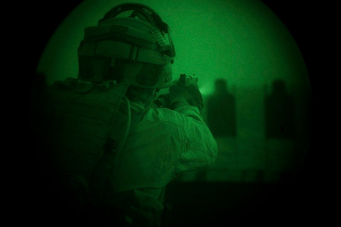 GULF OF ADEN (July 7, 2015) A U.S. Marine with the 15th Marine Expeditionary Unit’s Maritime Raid Force fires at his target during a low-light deck shoot aboard the amphibious assault ship USS Essex (LHD 2). The MRF practiced shooting in low-light conditions to familiarize themselves with their equipment and ensure they can shoot accurately. The 15th MEU is embarked on the Essex ARG and deployed to maintain regional security in the U.S. 5th Fleet area of operations. (U.S. Marine Corps photo by Cpl. Anna Albrecht/Released)