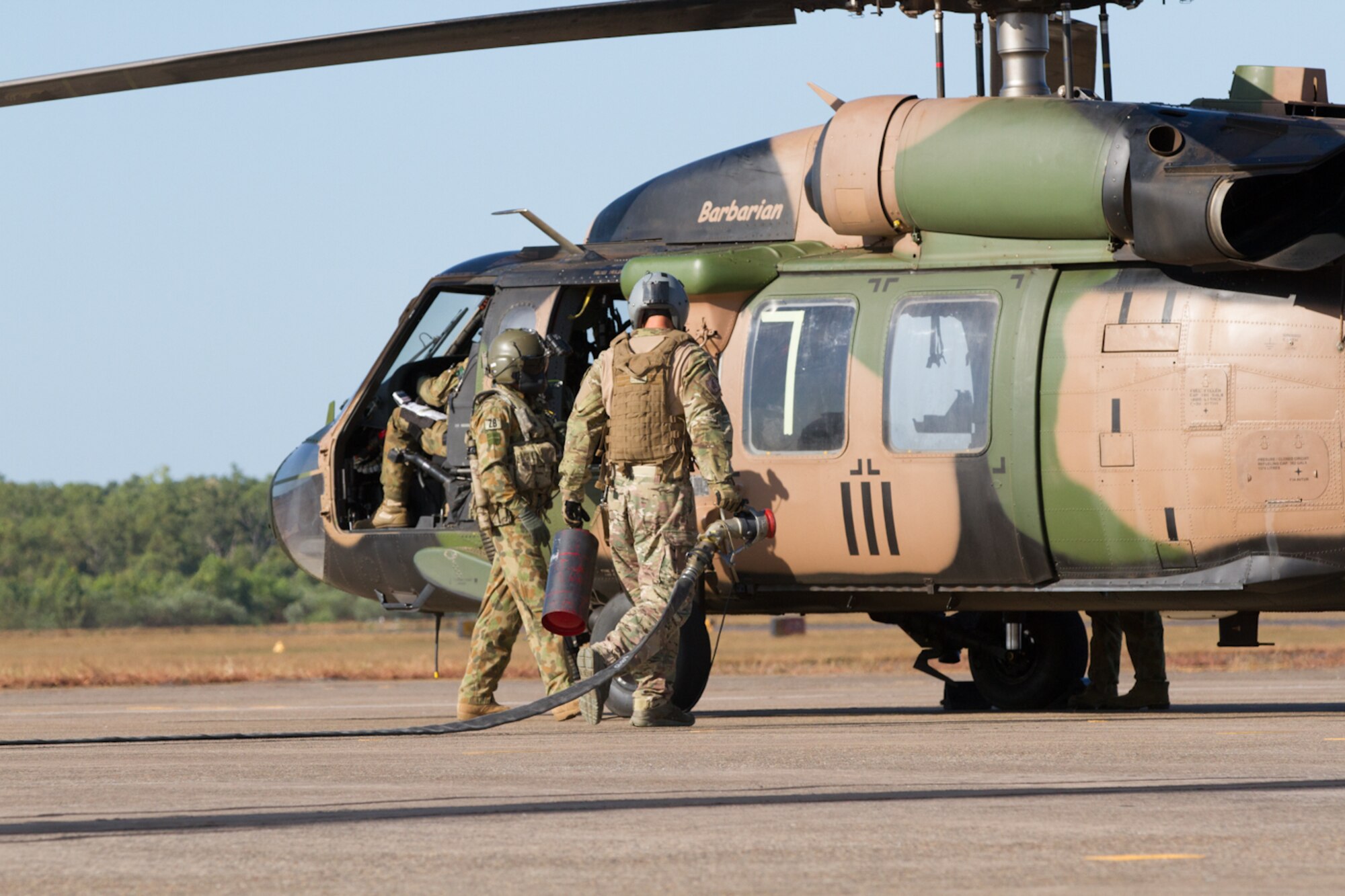 U.S. Air Force Airmen from the 18th Logistics Readiness Squadron from Kadena Air Base, Japan, partnered with the Australian Army during a refueling exercise at the Royal Australian Air Force Base Darwin, July 8, 2015, in Darwin, Australia during Talisman Sabre 2015. Talisman Sabre is a biennial exercise that provides an invaluable opportunity for nearly 30,000 U.S. and Australian defense forces to conduct operations in a combined, joint and interagency environment that will increase both countries’ ability to plan and execute a full range of operations from combat missions to humanitarian assistance efforts. (U.S. Army photo by Sgt. Steven Peterson/Released)