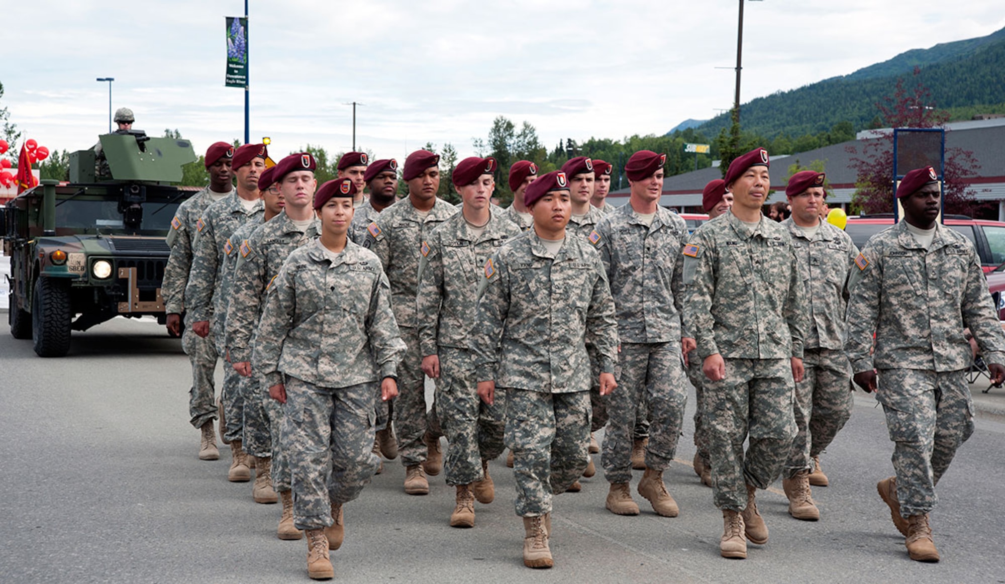 Soldiers from Joint Base Elmendorf-Richardson march in the annual Bear Paw Parade in Eagle River, Alaska, July 11, 2015. The Joint Base Against Drunk Driving and Drug Abuse Resistance Education vehicles, a Soldier marching unit from Joint Base Elmendorf-Richardson, and the 9th Army Band from Fort Wainwright, Alaska participated in this year’s Bear Paw Parade. (U.S. Air Force photo/Senior Airman Tammie Ramsouer)