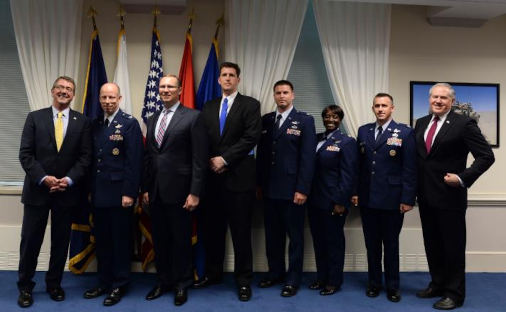 The AEHF Team receives the 2014 DoD Packard Award at a ceremony at the Pentagon, May 21.  Pictured from left to right are: Secretary of Defense Ashton Carter, Col. Stephen Purdy, Col. (ret) Rodney Miller, William Althoff, Maj. Darrell Grob, Maj. Alicia Abrams, Col. (sel) Shawn McCamish and Undersecretary of Defense (AT&L)  Frank Kendall.  