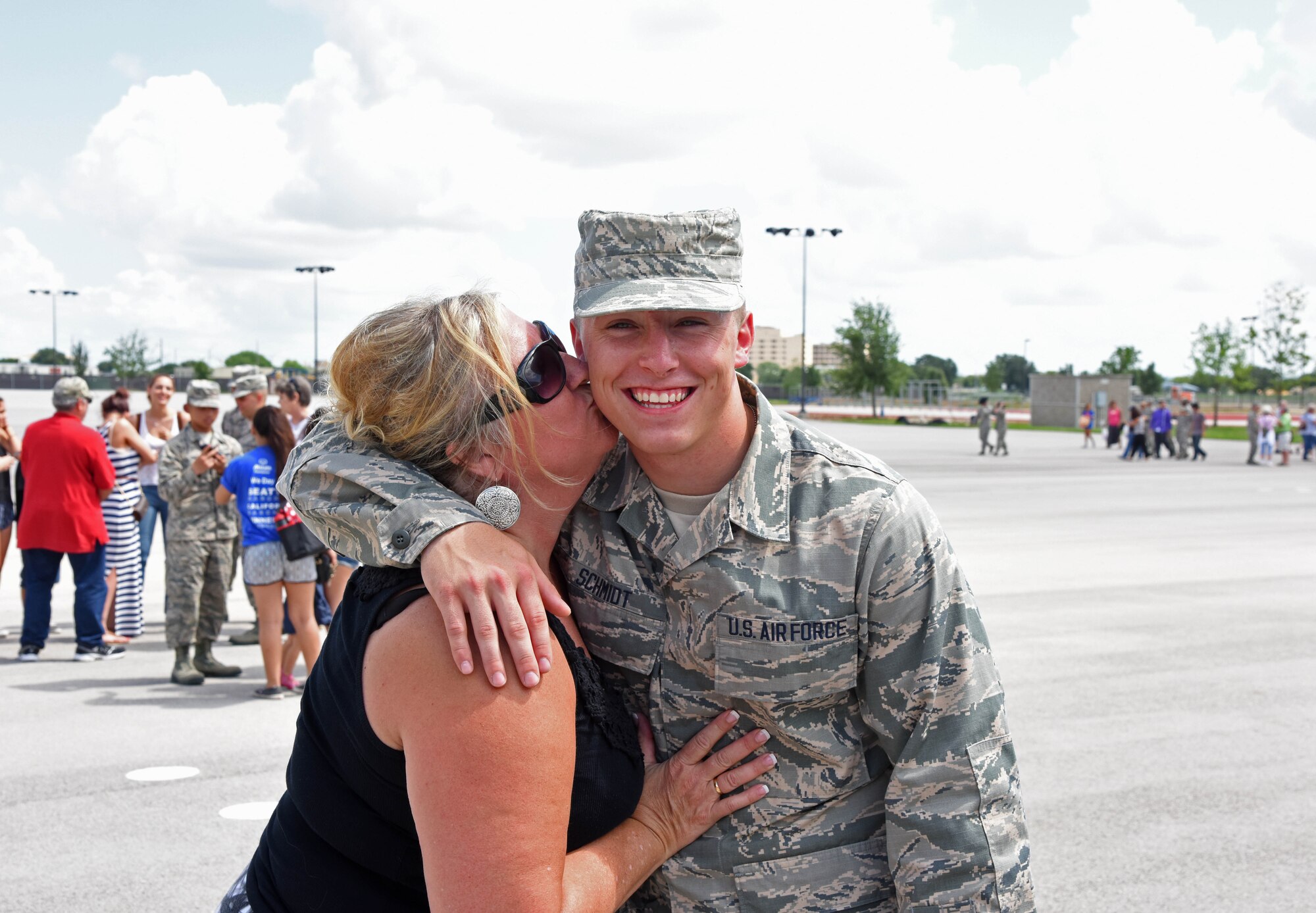 Logan Schmidt, right, poses for a photograph with his mother Anne after a graduation ceremony at Joint Base San Antonio, Texas, June 26. Logan was the last of his brothers to join the Air Force and currently is in technical school to become a medical technician. (Courtesy photo Airman 1st Class Collin Schmidt)