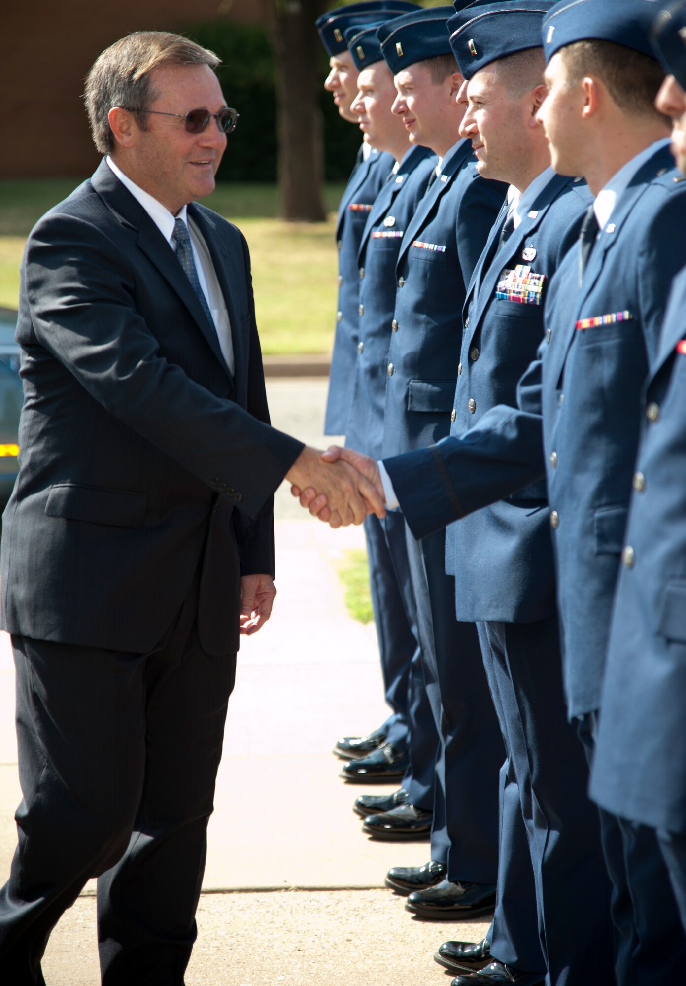 Retired Lt. Gen. Douglas Owens greets the student pilots of class 15-11 prior to their graduation ceremony July 1 at the Base Auditorium, Vance Air Force Base, Oklahoma.  Owens was the vice commander of Air Education and Training Command in 2013 before he retired. (U.S. Air Force photo/Staff Sgt. Nancy Falcon)