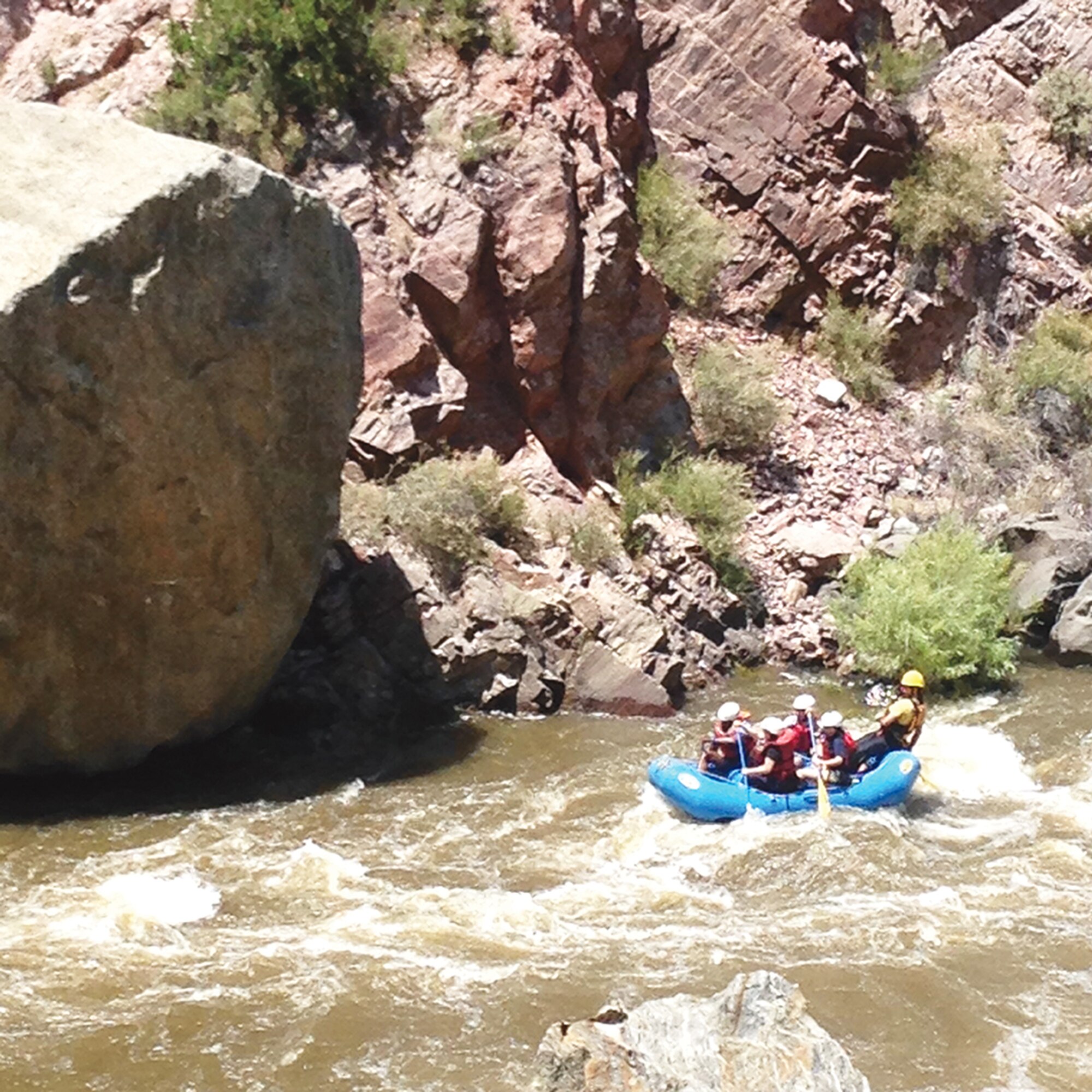 A group of volunteer rafting guides take a group of Outdoor Recreation clients on a trip down the Race Course on the Rio Grande, just outside of Pilar, N.M. in June. (Photo by Misty Kuhl)