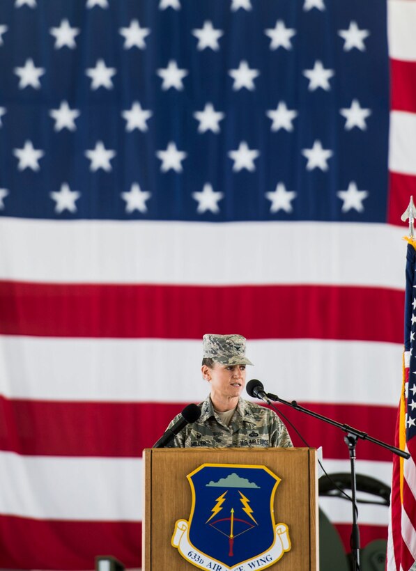 U.S. Air Force Col. Caroline Miller, 633rd Air Base Wing incoming commander, addresses the men and women of the 633rd ABW during a change of command ceremony at Langley Air Force Base, Virginia, July 13, 2015. Miller assumed command after serving as the 379th Mission Support Group commander at Al Udeid Air Base, Qatar. (U.S. Air Force photo by Senior Airman Kayla Newman/Released)