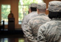 A formation representing the 4th Communications Squadron listens to Col. Joe Slavick, 4th Mission Support Group commander, give an opening address during the 4th Communications Squadron’s change of command ceremony, July 10, 2015, at Seymour Johnson Air Force Base, North Carolina. Maj. Gideon Hall, incoming 4th CS commander, will now step into the shoes formerly filled by Maj. Nelson Avilesfigueroa, outgoing 4th CS commander. (U.S. Air Force photo/Senior Airman Ashley J. Thum)