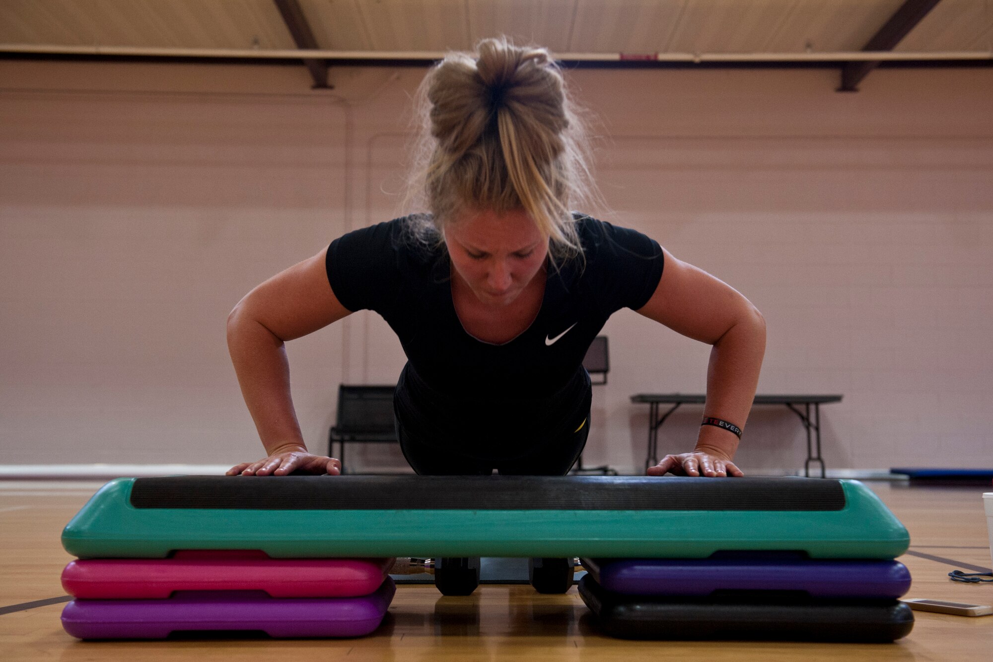 PETERSON AIR FORCE BASE, Colo. – Sarah Morris, fitness instructor, completes each workout with her class after demonstrating how each is properly done during the new class offered at the Peterson Air Force Base Fitness Center, July 8, 2015. The Compound is one of three new fitness classes offered at the base gym to provide Airmen with more options to change-up their workout, and is offered from 12:05–1 p.m. every Wednesday. (U.S. Air Force photo by Airman 1st Class Rose Gudex)