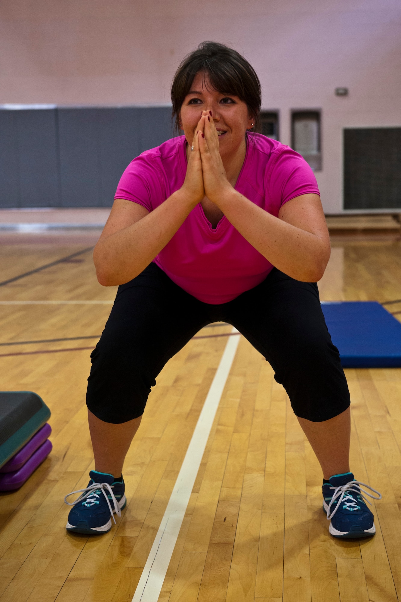 PETERSON AIR FORCE BASE, Colo. – Erika Chavez, The Compound participant, feels the burn during the new fitness class at the Peterson Air Force Fitness Center, July 8, 2015. The class began July 1 and will continue every Wednesday at 12:05–1 p.m. The total body workout helps build muscle while burning calories by incorporating cardio moves between every strength interval. (U.S. Air Force photo by Airman 1st Class Rose Gudex)