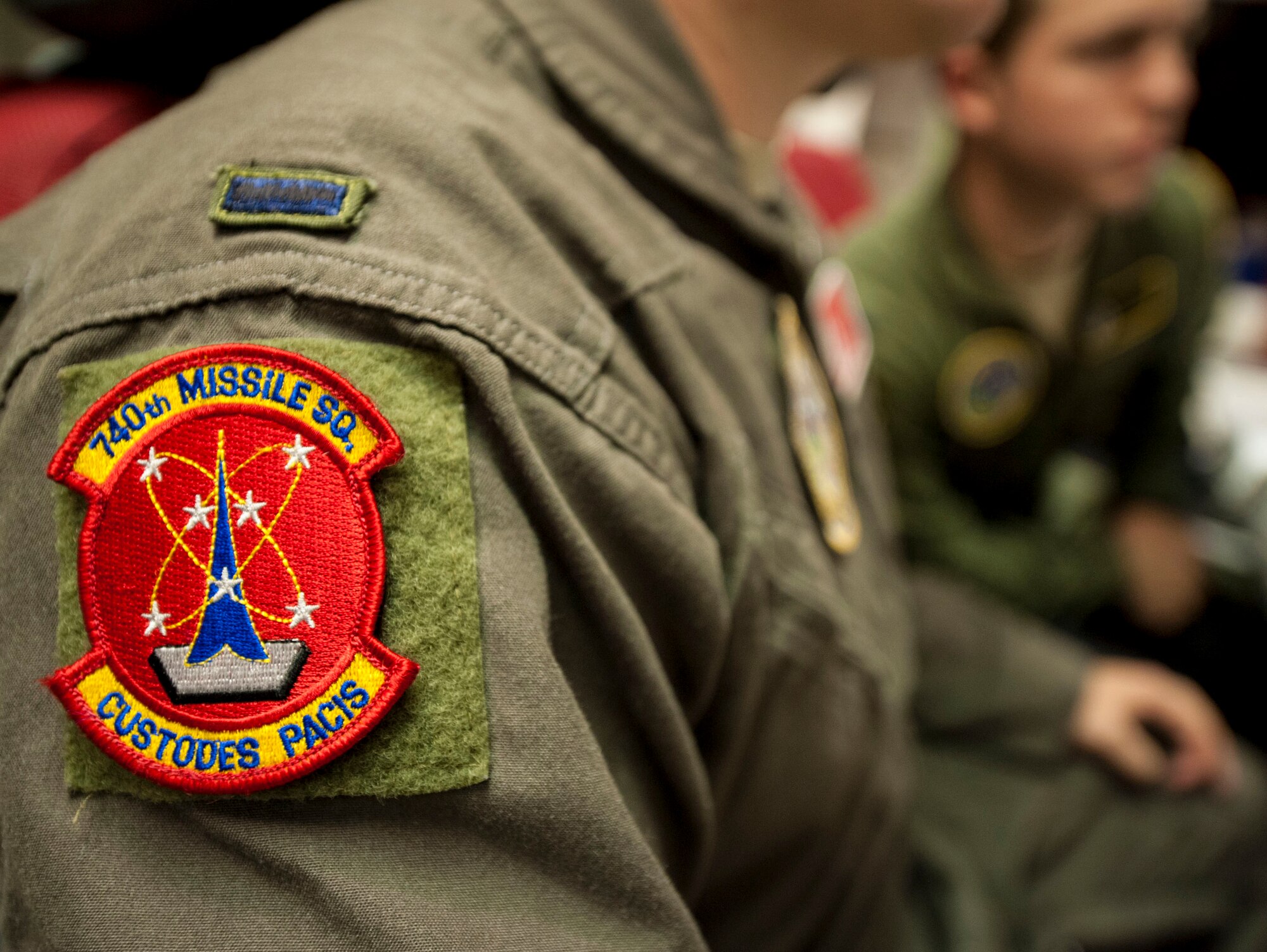 A 740th Missile Squadron patch is displayed on the shoulder of 1st Lt. Daniel Morris, 740th MS deputy combat crew commander’s uniform, at the Bravo 01 Missile Alert Facility, July 1, 2015. The 740th MS is comprised of officer crewmembers who, when on alert, are responsible for day-to-day operations, maintenance and security of the nuclear-capable missiles within their control and are prepared to launch their missiles at all times. (U.S. Air Force photo/Senior Airman Stephanie Morris)