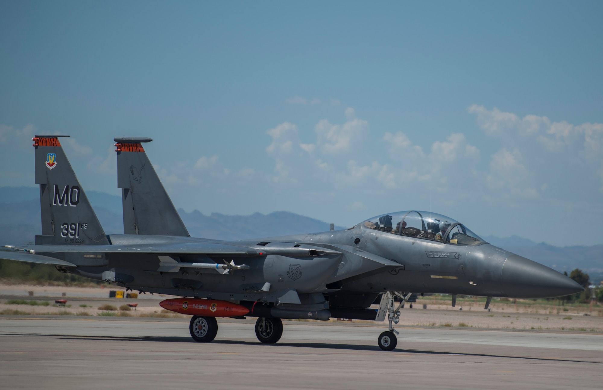 The 391st Fighter Squadron flagship F-15E Strike Eagle taxies off the runway at Nellis Air Force Base, Nev., July 7, 2015. Red Flag 15-3 is a realistic combat training exercise involving the air forces of the United States and its allies. The exercise is conducted on the 15,000-square-mile Nevada Test and Training Range, located north of Las Vegas. (U.S. Air Force photo by Senior Airman Brittany A. Chase)
