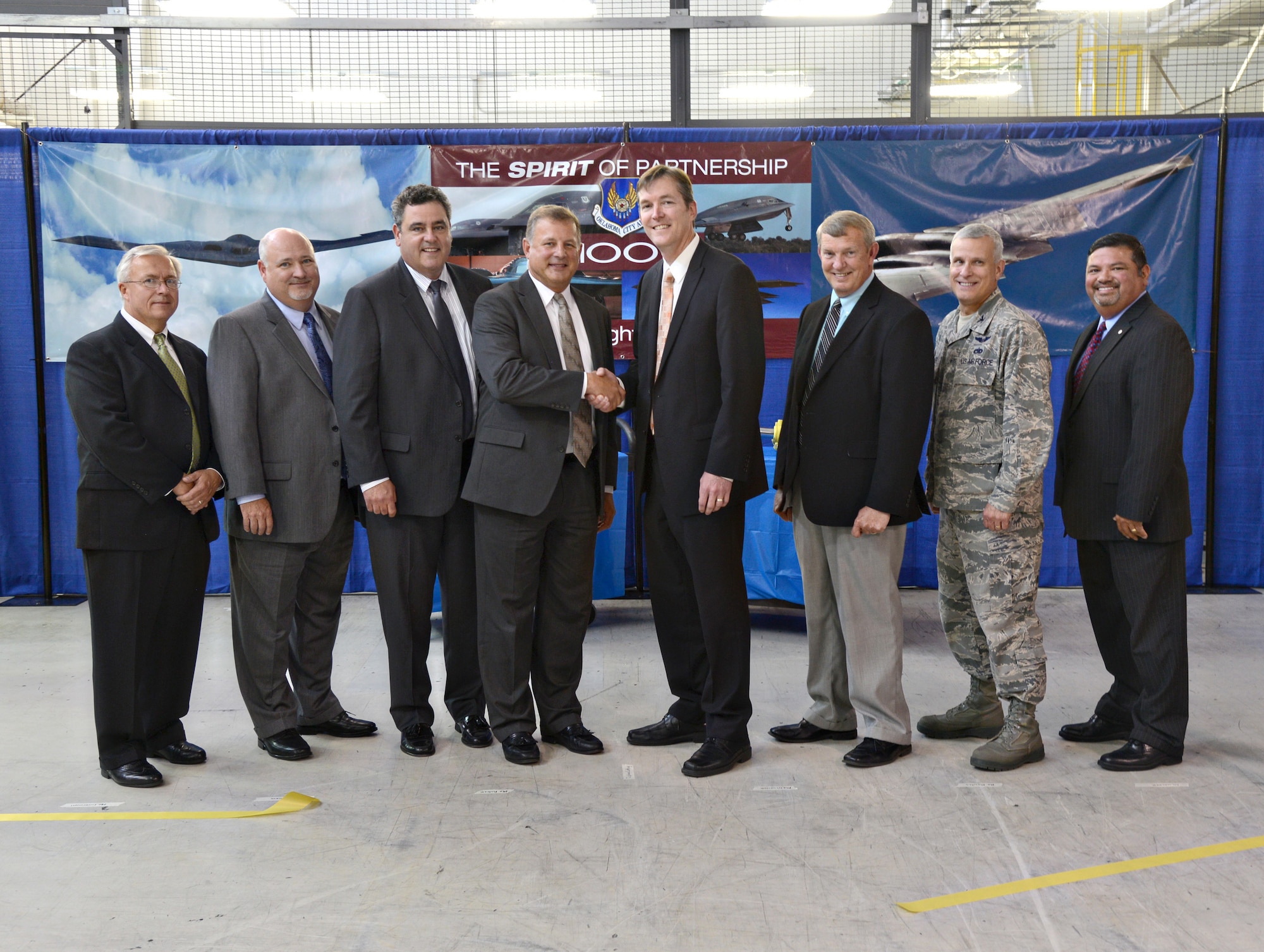 During a June 30 ceremony, members of the 76th Commodities Maintenance Group and Moog Inc. held a ribbon-cutting for their B-2 flight control actuator partnership. Moog will provide parts, logistics coordination and technical support to replace the actuators in the B-2. Participating in the ribbon-cutting are, from left, Larry Lopian, Moog B-2 Program manager; Jack Lucernoni, Moog depot operations manager; Joe Dillsworth, director of Air Force Programs for MOOG Aircraft Group; Marty Bobak, vice president of Military Global Support for Moog Aircraft Group; Kevin O’Connor, Oklahoma City Air Logistics Complex vice director; Mike Mowles, deputy director of the 76th CMXG; Col. Stephen Walker, individual mobilization augmentee to the 76th CMXG commander; and Joe Lopez, squadron director for the 550th CMMXS. (Air Force photo by Kelly White/Released)