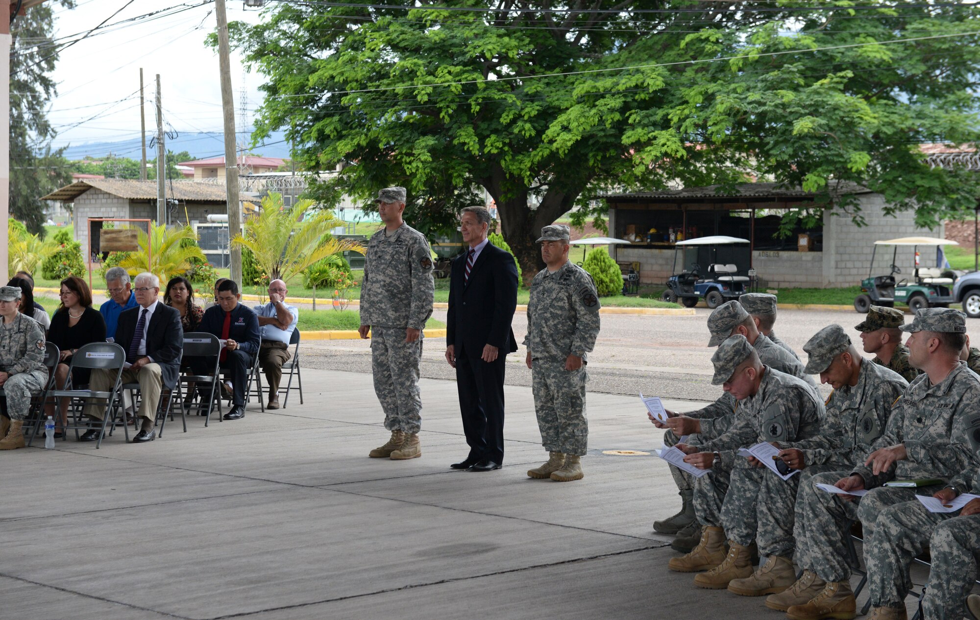 From left to right, Col. Rollin Miller, Army Support Activity outgoing commander, Mr. Thomas Schoenbeck, Army Installation Management Command regional director, and Col. Dan Barzyk, ASA incoming commander, prepare to march to the color guard in order to initiate the ASA change of command July 9, 2015. ASA supports the readiness and mission of Soto Cano by managing activities and services, maintaining facilities, optimizing resources, sustaining the environment and enhancing community wellbeing. (U.S. Air Force photo by Staff Sgt. Jessica Condit)