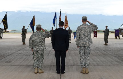 From left to right, Col. Dan Barzyk, Army Support Activity incoming commander, Mr. Thomas Schoenbeck, U.S. Army Installation Management Command regional director, and Col. Rollin Miller, ASA outgoing commander, salute the Honduran and American Flags throughout the playing of the national anthems during the ASA change of command ceremony, July 9, 2015, at Soto Cano Air Base, Honduras. ASA supports the readiness and mission of Soto Cano by managing activities and services, maintaining facilities, optimizing resources, sustaining the environment and enhancing community wellbeing.
 (U.S. Air Force photo by Staff Sgt. Jessica Condit) 
