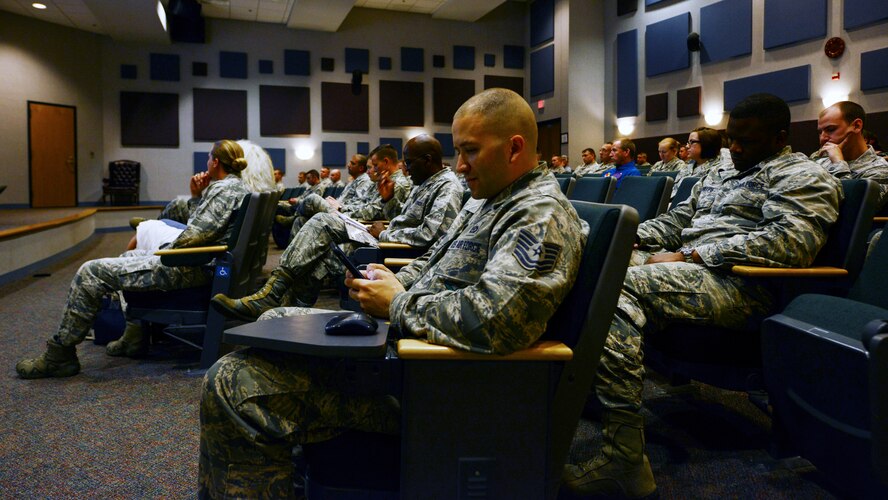 Dyess Airmen use their smartphones to participate in an interactive web-based presentation during Dyess’ Leadership and Innovation Forum with the Abilene Chief of Police June 16, 2015, at Dyess Air Force Base, Texas. Members of Team Dyess attended to listen to Stan Standridge discuss characteristics of leadership including the importance of humility, integrity, resiliency and accountability. (U.S. Air Force photo by Senior Airman Kedesha Pennant/Released)