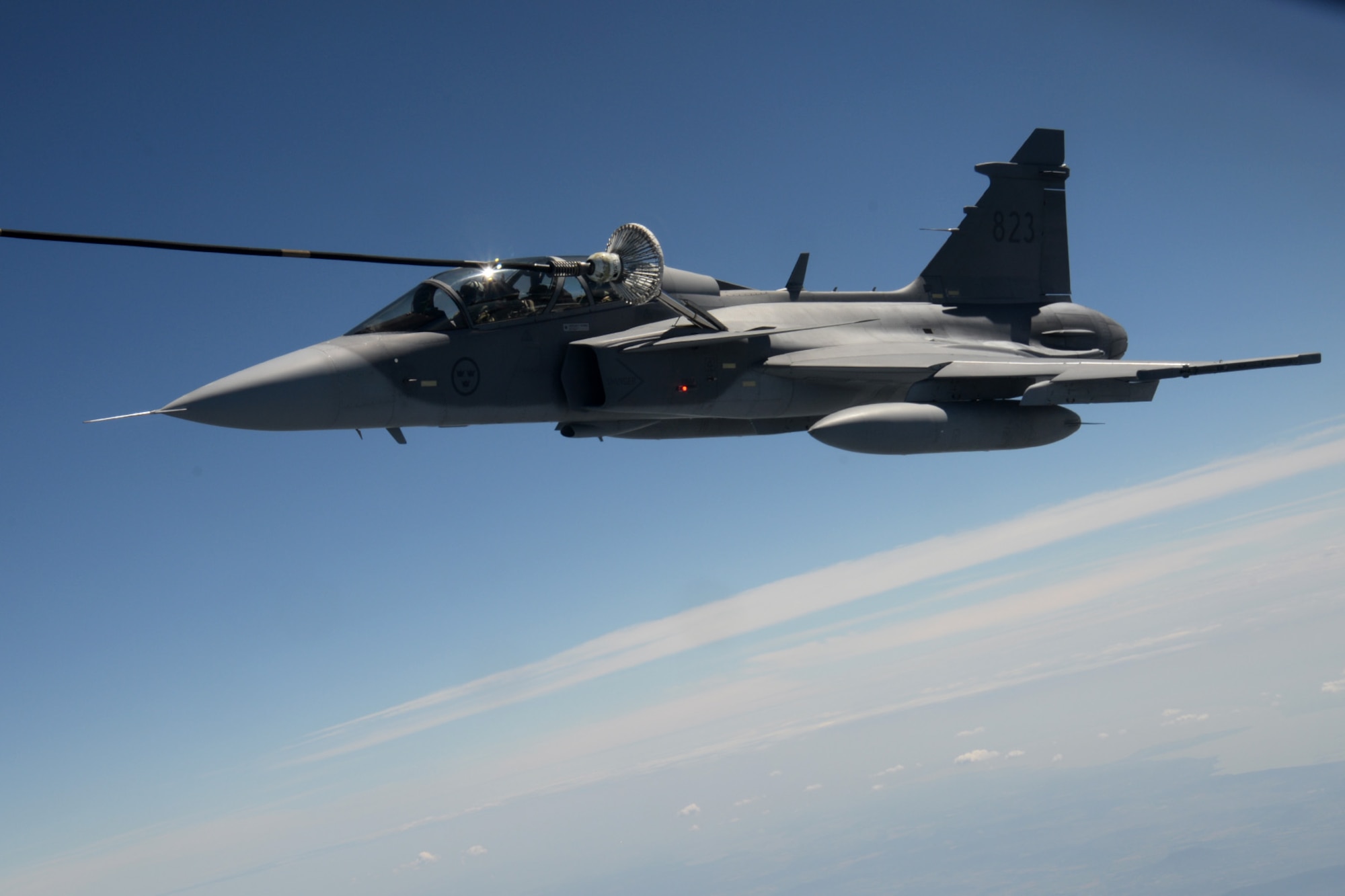A Hungarian air force JAS-39 Gripen makes contact with a multi-point refueling system basket June 26, 2015, during air refueling familiarization training over Hungary. Hungarian, U.S. and Swedish air force personnel met for a two-week familiarization period enabling the Hungarian JAS-39 Gripen pilots to successfully perform air refueling for the first time. (U.S. Air Force photo by Senior Airman Kate Thornton/Released)