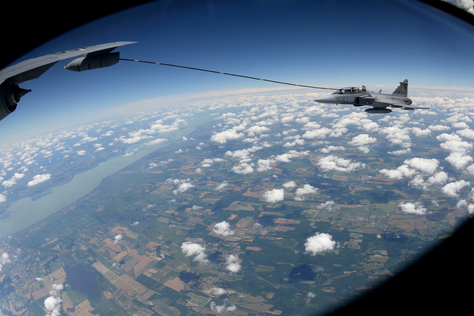 A Hungarian air force JAS-39 Gripen makes contact with a multi-point refueling system basket June 25, 2015, during air refueling familiarization training over Hungary. Hungarian, U.S. and Swedish air force personnel met for a two-week familiarization period enabling the Hungarian JAS-39 Gripen pilots to successfully perform air refueling for the first time. (U.S. Air Force photo by Senior Airman Kate Thornton/Released)