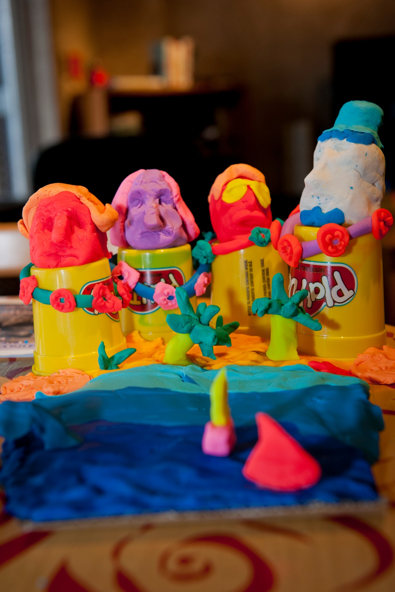 PETERSON AIR FORCE BASE, Colo. -- -- Contestants create a tropical version of the famous rock sculpture at the first ever Mount Rushmore building competition at the Eclipse Cyber Café, July 8, 2015. The team who created this masterpiece consisted of Tech. Sgt. Jason Carpenter, Airman 1st Class Orenzio Robinson, Airman 1st Class Courtney Hutcherson and Airman 1st Class Samuel Lupica. (U.S. Air Force photo by Airman 1st Class Rose Gudex)