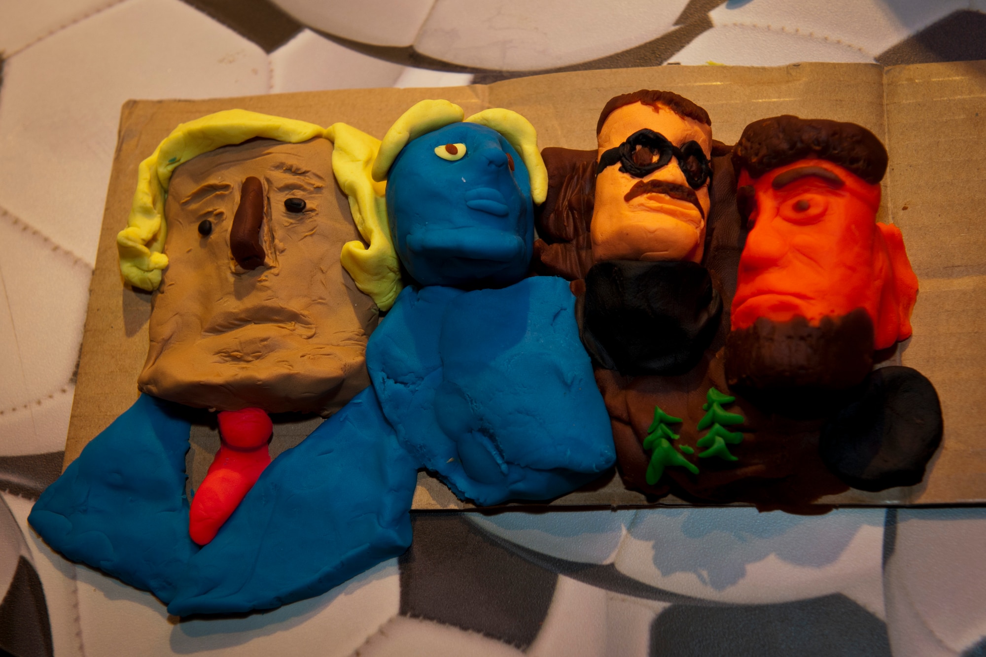 PETERSON AIR FORCE BASE, Colo. – The 21st Dental Squadron continue their positive representation at chapel sponsored events by winning first place in the first ever Mount Rushmore building competition at the Eclipse Cyber Café, July 8, 2015. The dental lab technicians contributing to the success included Senior Airman Laura Takakuwa, Senior Airman Khody Morgan, Airman 1st Class David Garcia and Airman 1st Class Matthew Towles. (U.S. Air Force photo by Airman 1st Class Rose Gudex)