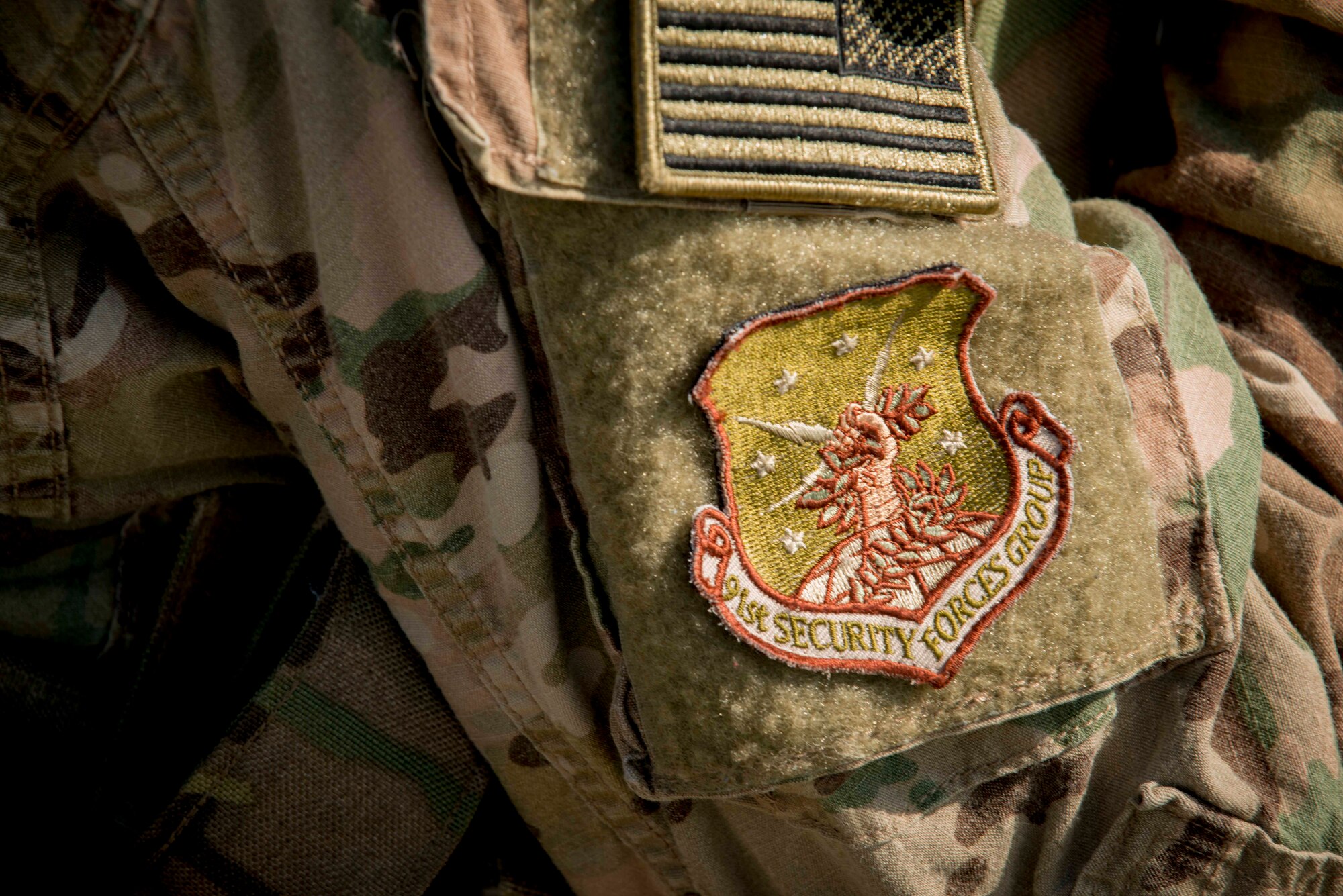 A patch rests on the uniform of a 91st Security Forces Group member at a launch facility near Donnybrook, N.D., June 29, 2015. Airmen from 219th Security Forces Squadron and 791st Missile Security Forces Squadron worked together to pacify personnel dressed as simulated aggressors and recapture a launch facility. (U.S. Air Force photo/Airman 1st Class Sahara L. Fales)