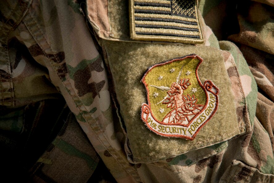 A patch rests on the uniform of a 91st Security Forces Group member at a launch facility near Donnybrook, N.D., June 29, 2015. Airmen from 219th Security Forces Squadron and 791st Missile Security Forces Squadron worked together to pacify personnel dressed as simulated aggressors and recapture a launch facility. (U.S. Air Force photo/Airman 1st Class Sahara L. Fales)