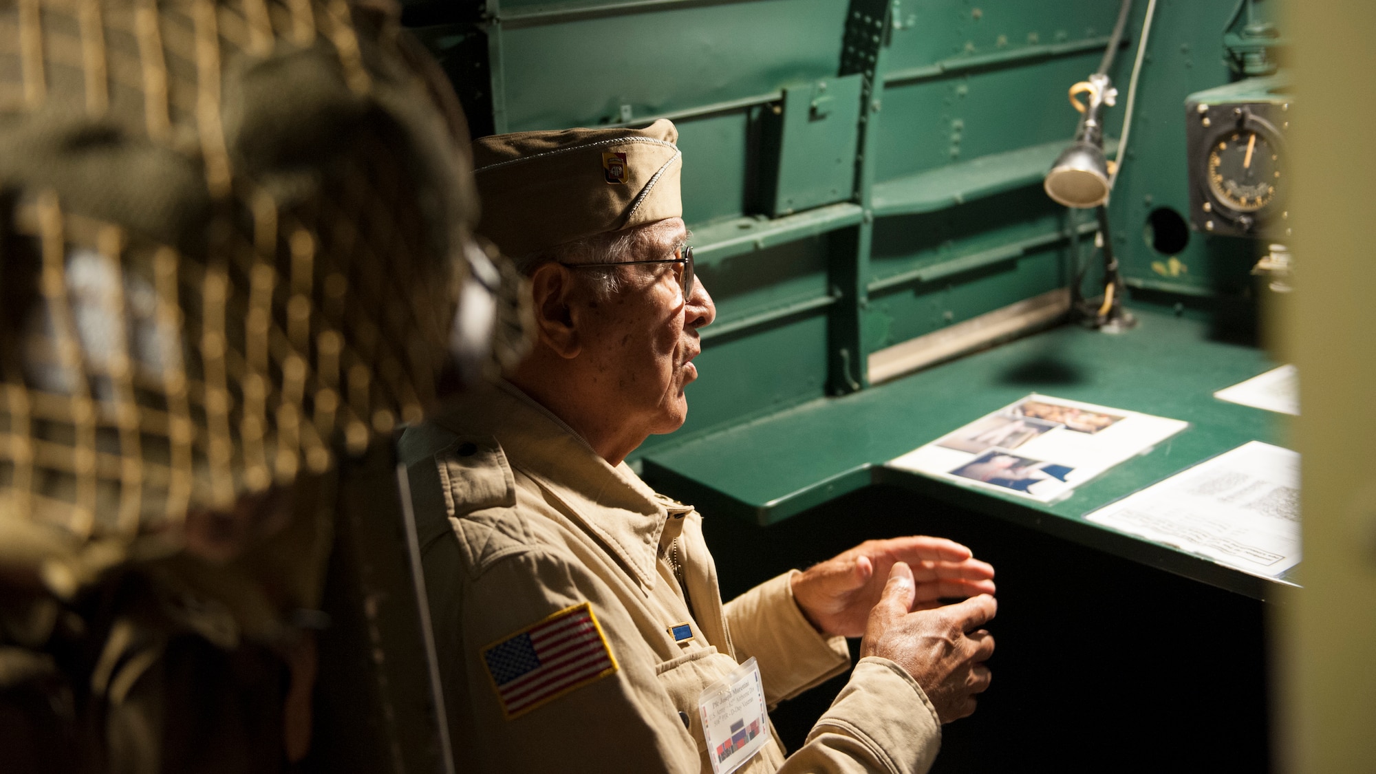 Joe Morettini sits in the navigator seat of a C-47A Skytrain July 9, 2015, at the Air Mobility Command Museum on Dover Air Force Base, Del. Morettini was formerly with Easy Company, 508th Parachute Infantry Regiment, 82nd Airborne Division during World War II. (U.S. Air Force photo/Airman 1st Class Zachary Cacicia)