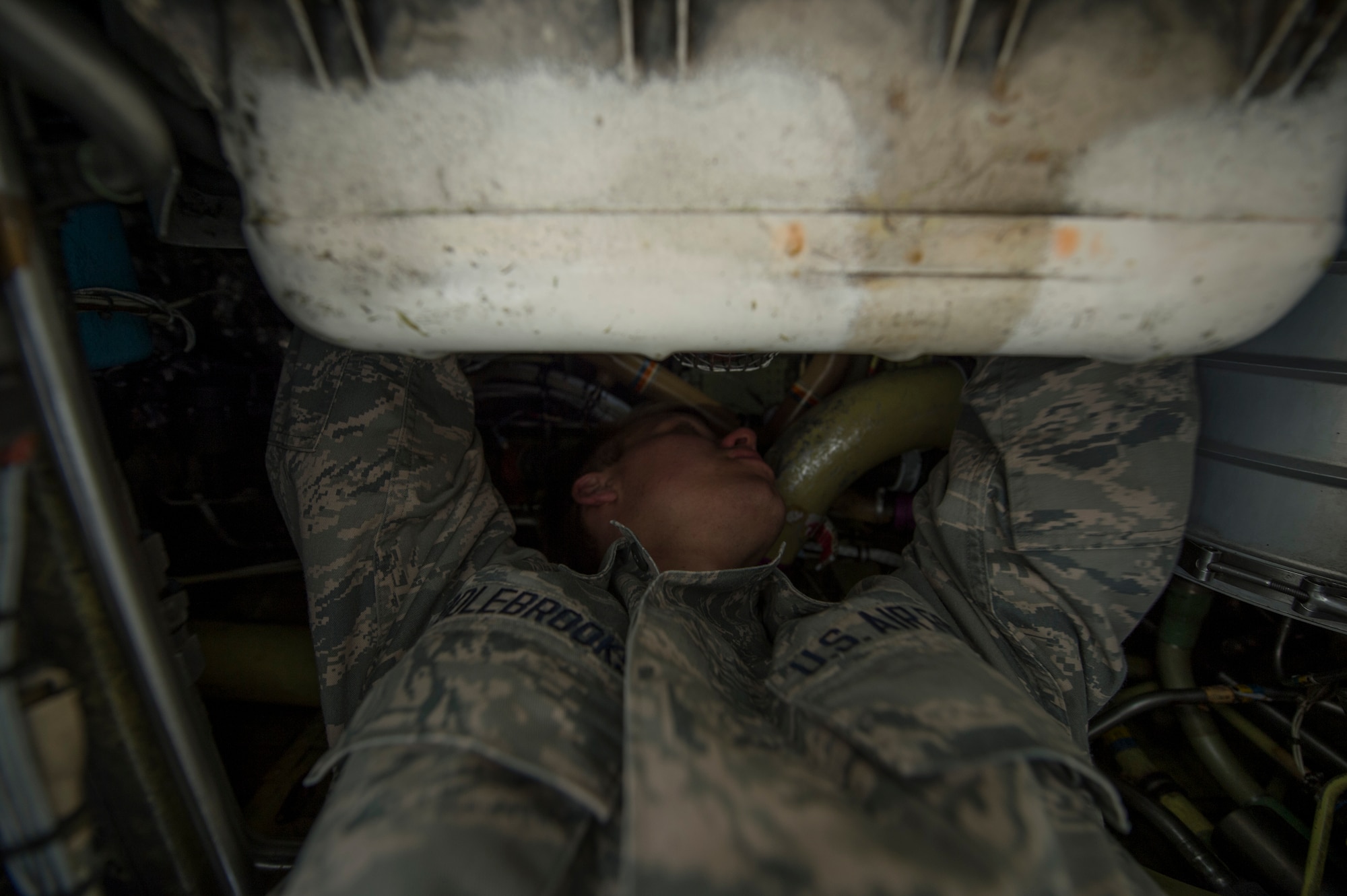 A U.S. Air Force maintenance Airman assigned to the 354th Expeditionary Fighter Squadron performs maintenance inside an A-10 Thunderbolt II attack aircraft during a theater security package deployment to Lask Air Base, Poland, July 10, 2015. U.S. Air Force Airmen and support equipment from the 355th Fighter Wing at Davis-Monthan Air Force Base, Ariz., and the 52nd Fighter Wing at Spangdahlem Air Base, Germany, supported this deployment. (U.S. Air Force photo by Staff Sgt. Christopher Ruano/Released)