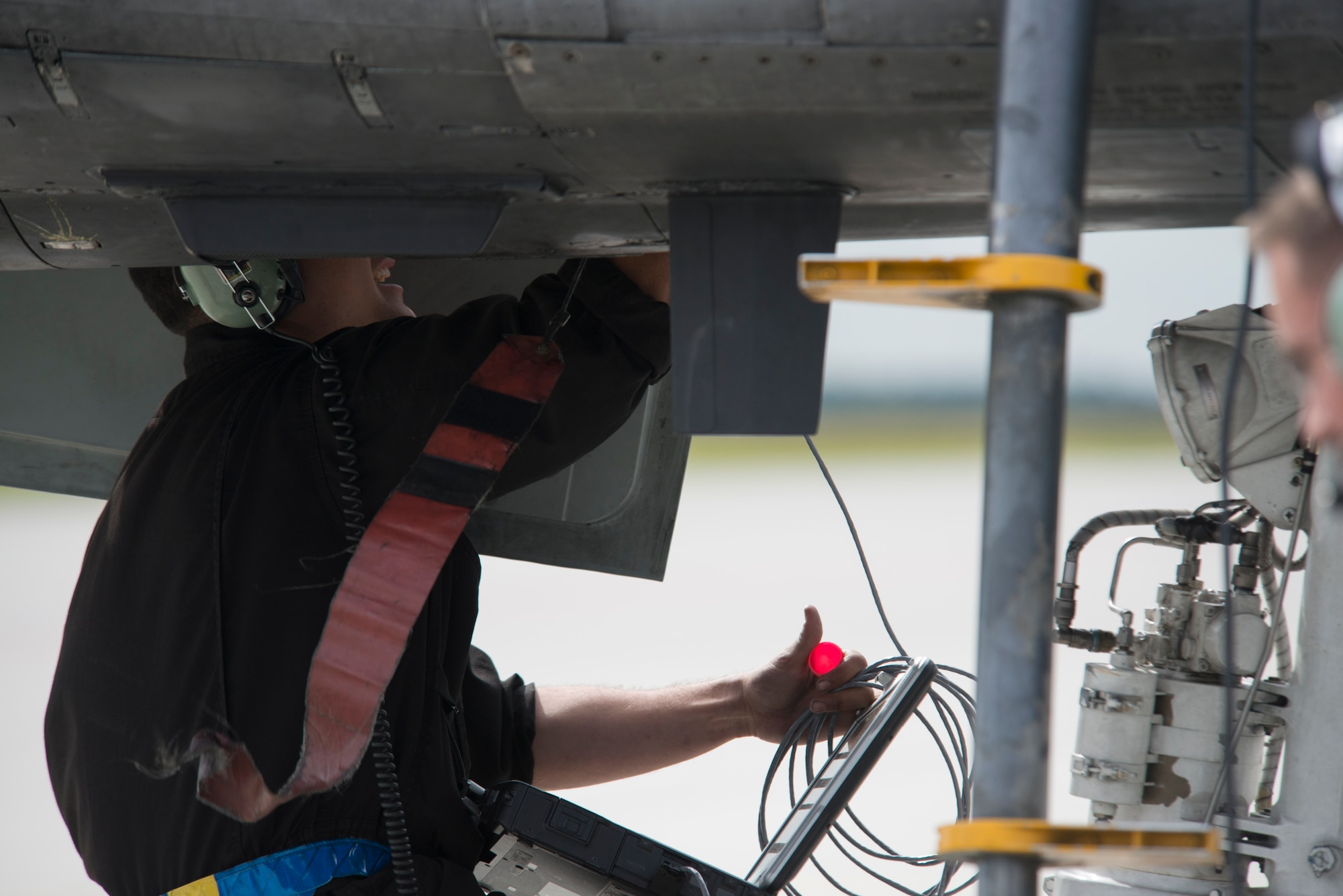 A U.S. Air Force maintenance Airman assigned to the 354th Expeditionary Fighter Squadron runs a system test on an A-10 Thunderbolt II attack aircraft during a theater security package deployment to Lask Air Base, Poland, July 10, 2015. The Aviation Detachment 1, 52nd Operations Group provided support to the 354th EFS mission during this TSP deployment and other U.S. Air Force operations in the region. (U.S. Air Force photo by Staff Sgt. Christopher Ruano)