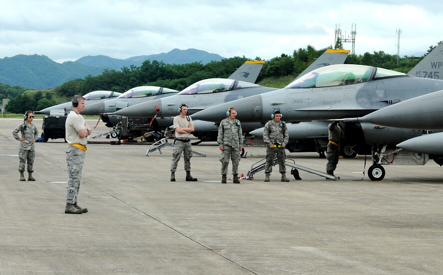 Master Sgt. David Batterson, 80th Aircraft Maintenance Unit production superintendent, prepares to launch an F-16 Fighting Falcon during Buddy Wing 15-6 at Jungwon Air Base, Republic of Korea, July 8, 2015. Buddy Wing is part of a combined fighter exchange program designed to improve interoperability between U.S. Air Force and ROKAF fighter squadrons and are conducted multiple times throughout the year in order to promote cultural awareness and sharpen combined combat capabilities. (U.S. Air Force photo by Senior Airman Divine Cox/Released)