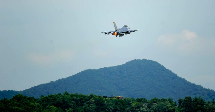 An F-16 Fighting Falcon from the 80th Fighter Squadron takes off at Jungwon Air Base, Republic of Korea, during Buddy Wing 15-6, July 8, 2015. In an effort to enhance U.S. and ROKAF air combat capability, Buddy Wing exercises are conducted multiple times throughout the year on the peninsula to sharpen interoperability between the allied forces so that if need be, they are always ready to fight as a combined force. (U.S. Air Force photo by Staff Sgt. Nick Wilson/Released)