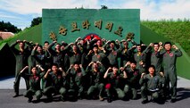 Republic of Korea Air Force KF-16 Fighting Falcon pilots from the 19th Fighter Wing and F-16 pilots from the 80th Fighter Squadron, Kunsan Air Base, Republic of Korea, render a “crush ‘em” gesture at Jungwon Air Base, ROK, during Buddy Wing 15-6, July 8, 2015. In an effort to enhance U.S. and ROKAF air combat capability, Buddy Wing exercises are conducted multiple times throughout the year on the peninsula to sharpen interoperability between the allied forces so that if need be, they are always ready to fight as a combined force. (U.S. Air Force photo by Staff Sgt. Nick Wilson/Released) 