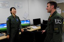 Republic of Korea Air Force Capt. Jin-Young Seol, 19th Fighter Wing KF-16 Fighting Falcon pilot, converses with U.S. Air Force Capt. Daniel Wynn, 80th Fighter Squadron assistant director of operations, Kunsan Air Base, Republic of Korea, at Jungwon Air Base, , ROK, during Buddy Wing 15-6, July 8, 2015. In an effort to enhance U.S. and ROKAF air combat capability, Buddy Wing exercises are conducted multiple times throughout the year on the peninsula to sharpen interoperability between the allied forces so that if need be, they are always ready to fight as a combined force. (U.S. Air Force photo by Staff Sgt. Nick Wilson/Released)