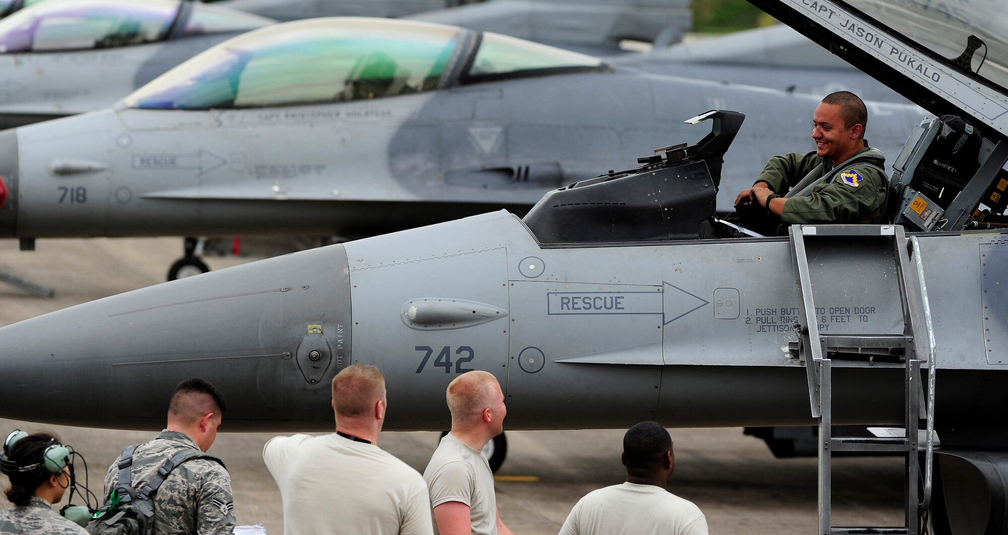 1st Lt. Bryce Turner, 80th Fighter Squadron F-16 Fighting Falcon pilot, Kunsan Air Base, Republic of Korea, talks with Airmen from the 80th Aircraft Maintenance Unit upon arrival to Jungwon Air Base, ROK, during Buddy Wing 15-6, July 8, 2015. In an effort to enhance U.S. and ROKAF air combat capability, Buddy Wing exercises are conducted multiple times throughout the year on the peninsula to sharpen interoperability between the allied forces so that if need be, they are always ready to fight as a combined force. (U.S. Air Force photo by Staff Sgt. Nick Wilson/Released)
