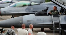 1st Lt. Bryce Turner, 80th Fighter Squadron F-16 Fighting Falcon pilot, Kunsan Air Base, Republic of Korea, talks with Airmen from the 80th Aircraft Maintenance Unit upon arrival to Jungwon Air Base, ROK, during Buddy Wing 15-6, July 8, 2015. In an effort to enhance U.S. and ROKAF air combat capability, Buddy Wing exercises are conducted multiple times throughout the year on the peninsula to sharpen interoperability between the allied forces so that if need be, they are always ready to fight as a combined force. (U.S. Air Force photo by Staff Sgt. Nick Wilson/Released)