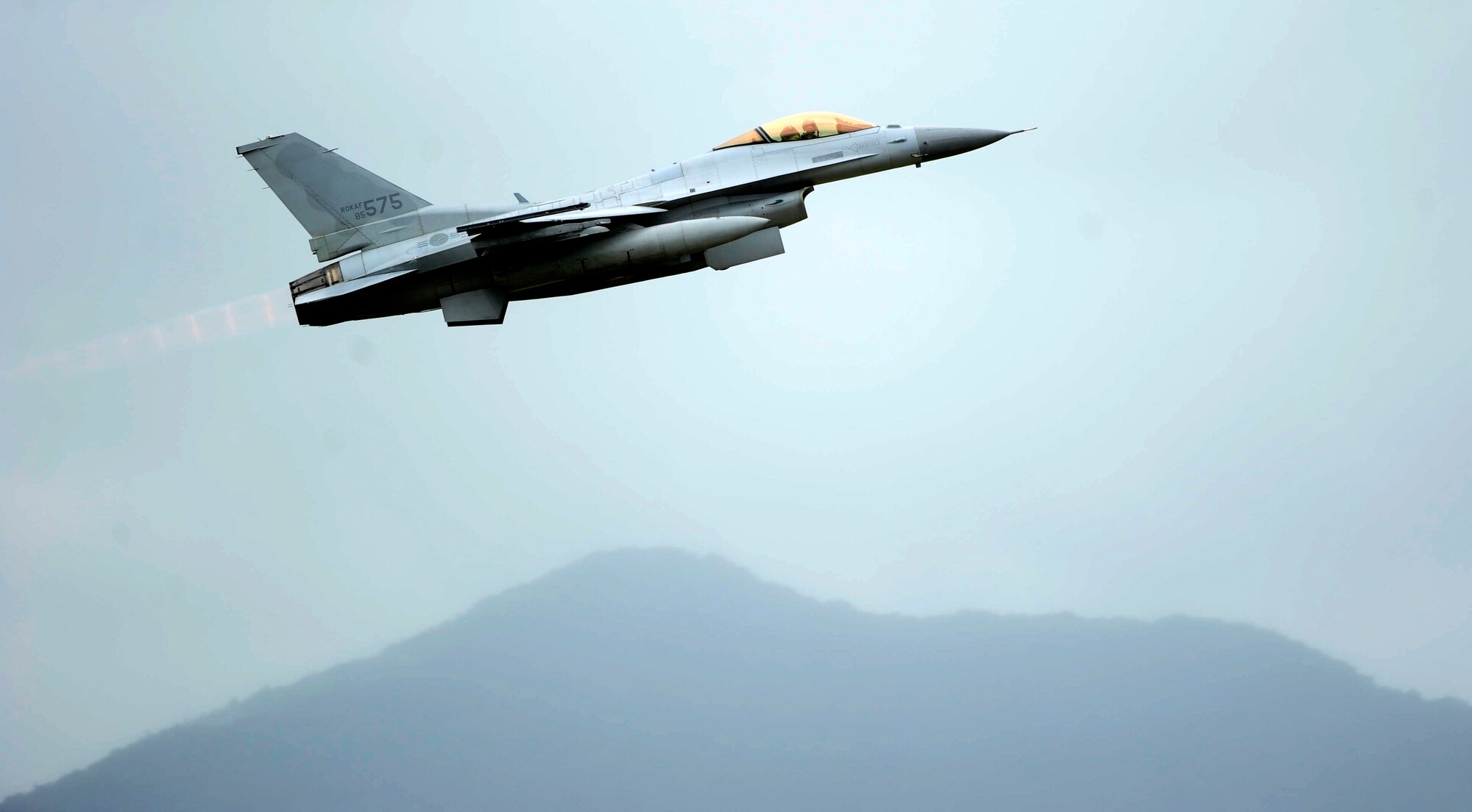 A KF-16 Fighting Falcon from the 19th Fighter Wing takes off at Jungwon Air Base, Republic of Korea, during Buddy Wing 15-6, July 8, 2015. In an effort to enhance U.S. and ROKAF air combat capability, Buddy Wing exercises are conducted multiple times throughout the year on the peninsula to sharpen interoperability between the allied forces so that if need be, they are always ready to fight as a combined force. (U.S. Air Force photo by Staff Sgt. Nick Wilson/Released) 