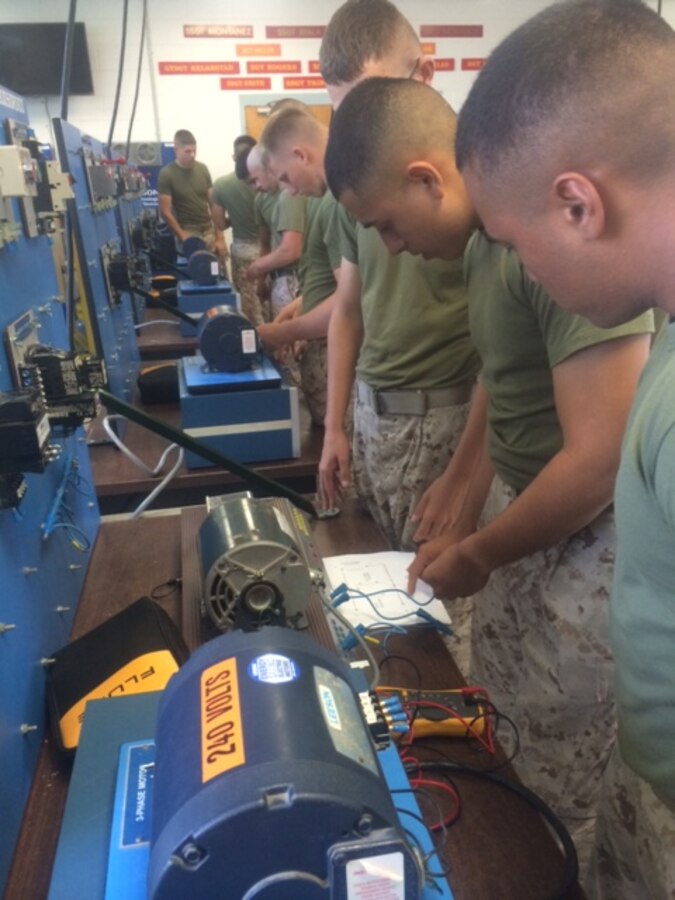 Marines from BRACT 2-15 learn about motors.