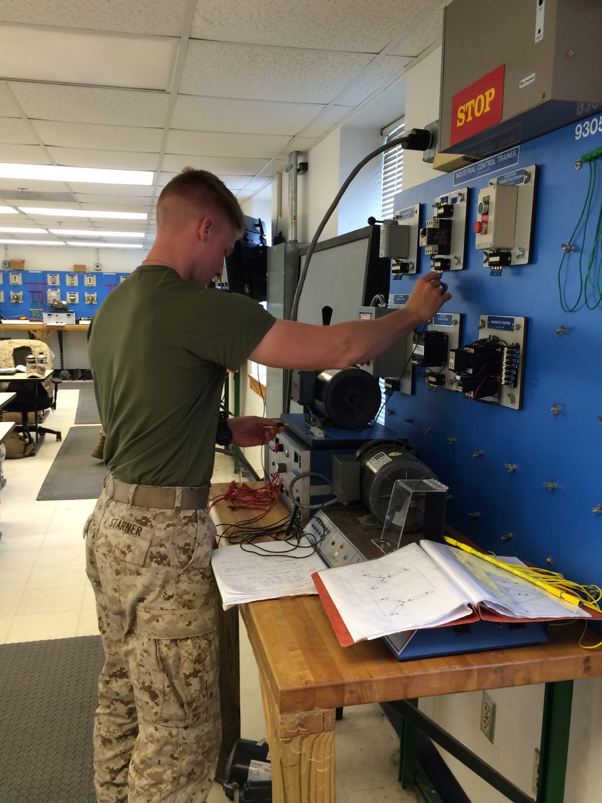 A Marine from BE 7-15 learns about motors.