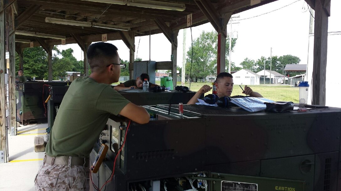 Marines from BEEEST 6-15 conduct a practical application on electrical systems of the medium generator set.