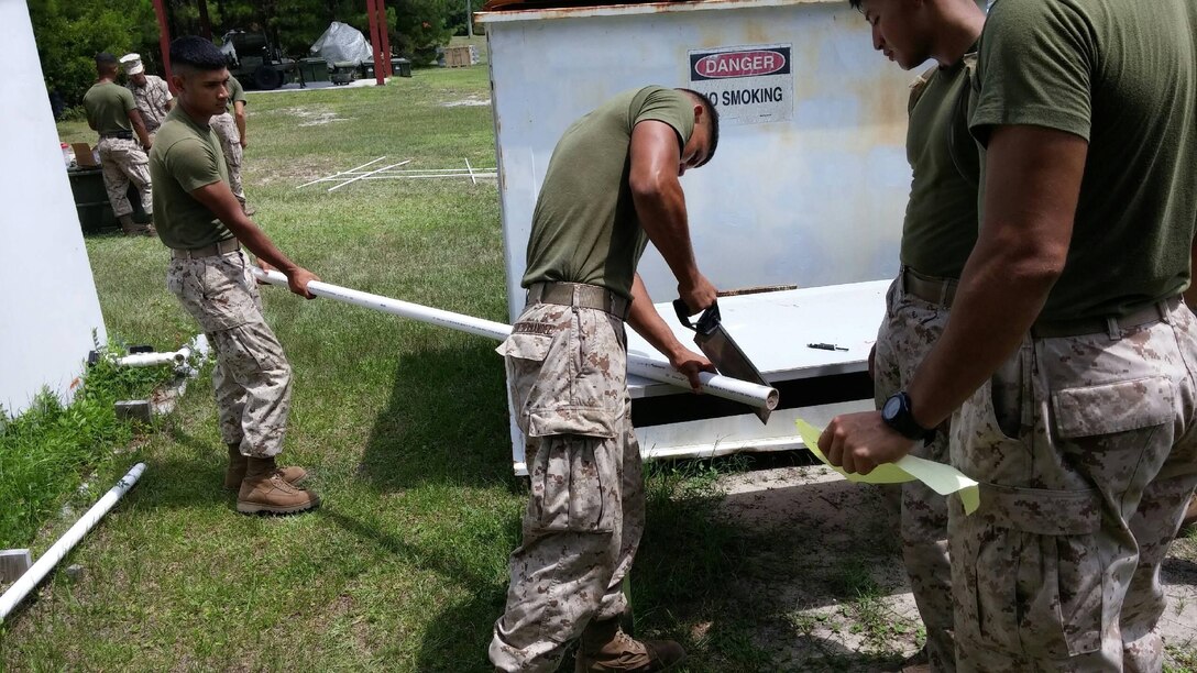 Marines from BWST 6-15 conduct a practical application on plumbing.