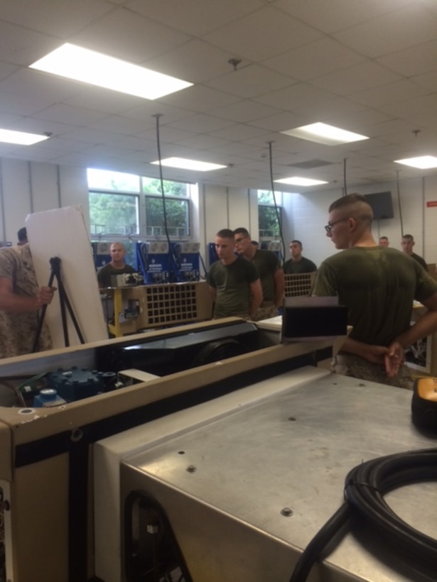 Marines from BRACT 4-15 learn how to troubleshoot the Small Field Refrigeration System (SFRS).