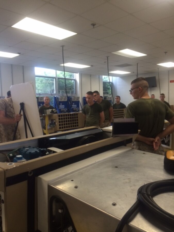 Marines from BRACT 4-15 learn how to troubleshoot the Small Field Refrigeration System (SFRS).