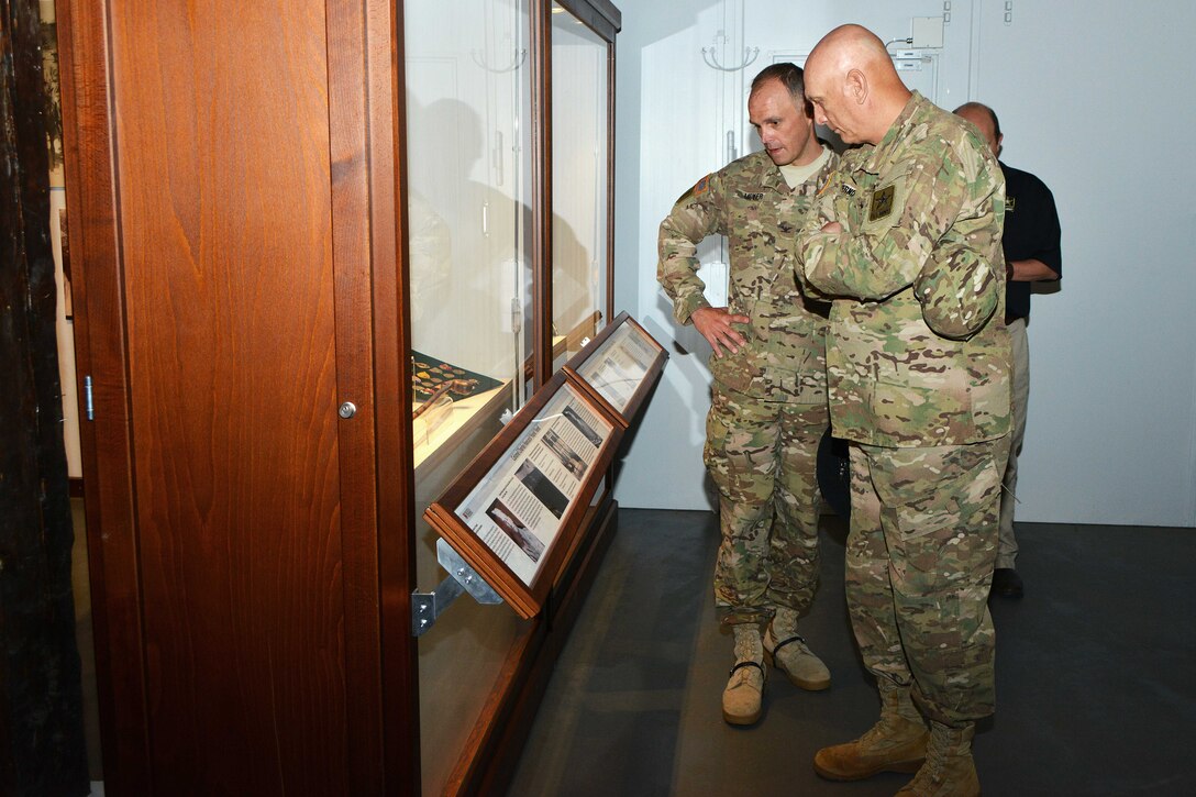 U.S. Army Col. John V. Meyer, left, commander of the 2nd Cavalry Regiment, gives U.S. Army Chief of Staff Gen. Ray Odierno a tour through the Reed Museum on Rose Barracks in Vilseck, Germany, July 9, 2015.