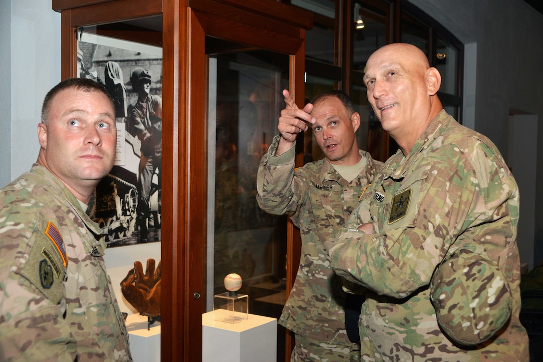 U.S. Army Col. John V. Meyer, center, and U.S. Army Sgt. Maj. Shane E. Pospisil, left, give U.S. Army Chief of Staff Gen. Ray Odierno a tour through the 2nd Cavalry Regiment's Reed Museum on Rose Barracks in Vilseck, Germany, July 9, 2015.