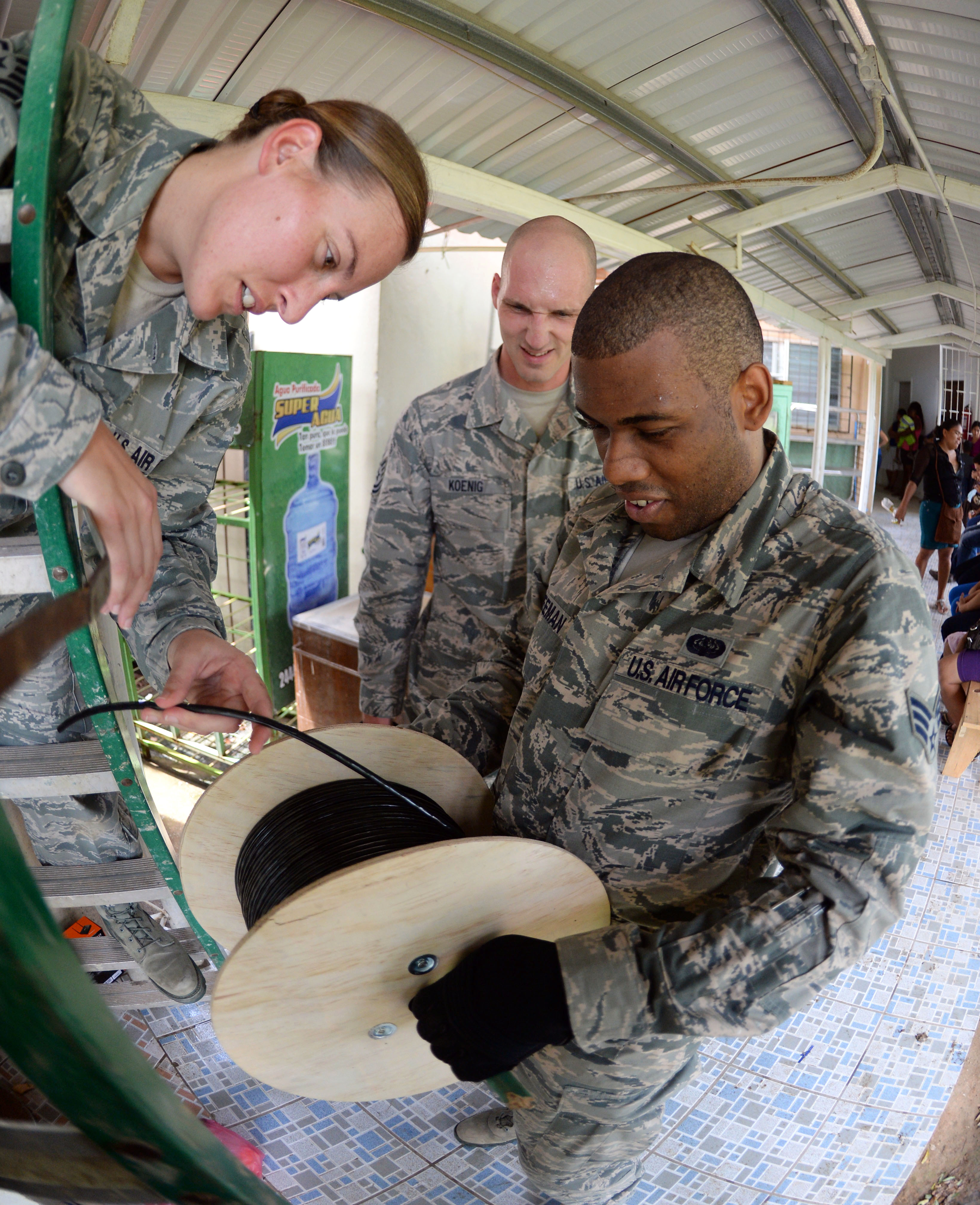 U.S. Air Force Tech Sgt. Carl Koenig, center, U.S. Air Force Senior
