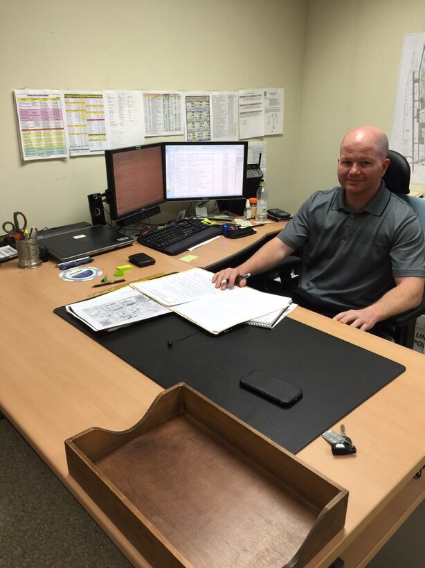 Chris Martin, new resident engineer at the Kunsan resident office, at his desk on Kunsan Air Base. 