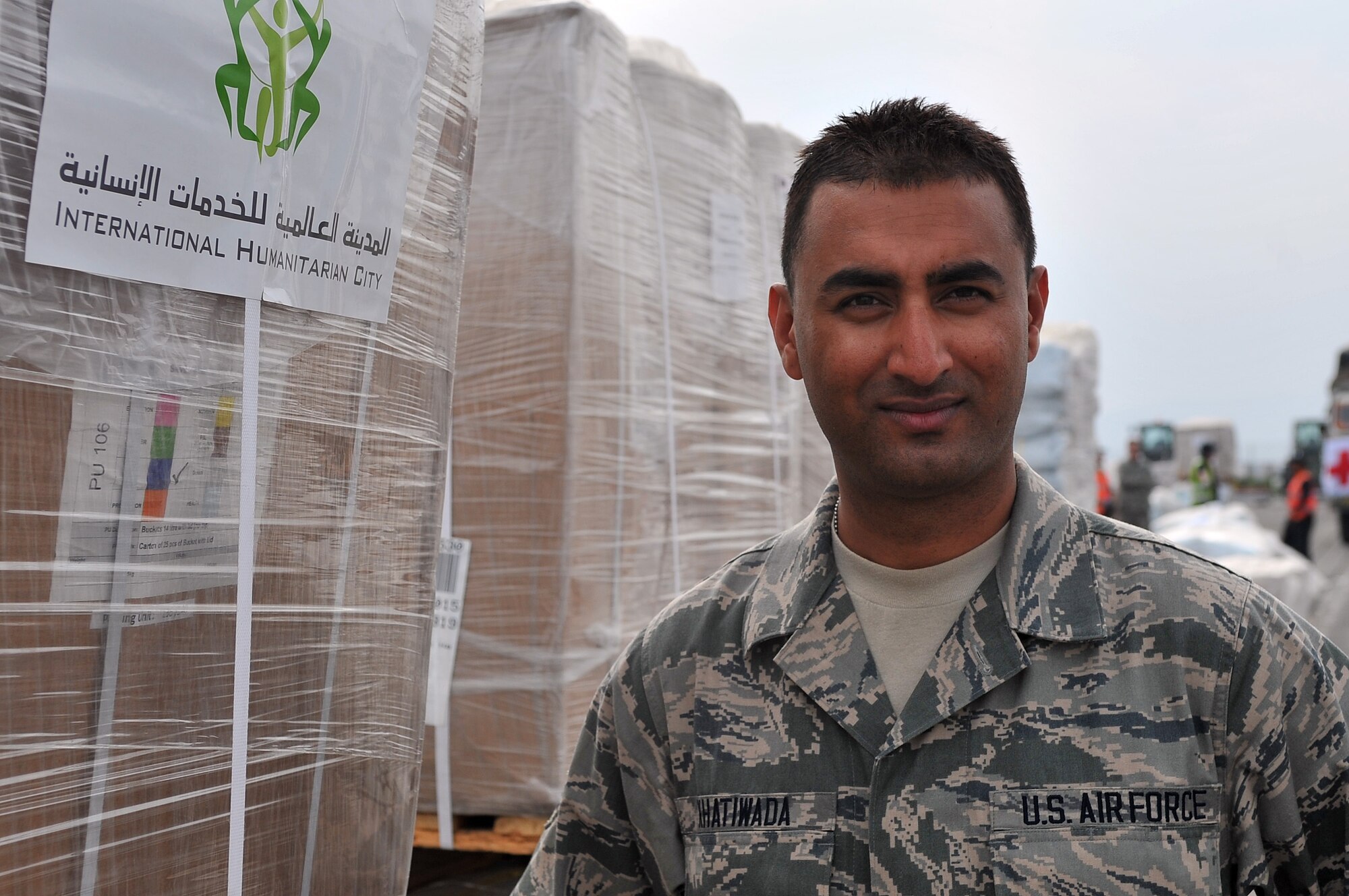 U.S. Air Force Senior Airman Manoj Khatiwada, 21st Medical Operations Squadron aerospace medical technician, stand in front of a pallet of humanitarian assistance and disaster relief supplies, Tribhuvan International Airport in Kathmandu, Nepal, May 8, 2015. Manoj joined a team from the 36th Contingency Response Group to assist U.S. Air Force, U.S. Department of State and U.S. Agency for International Development operations by assisting with communicating with the Nepalese Army as they process relief supplies following a magnitude 7.8 earthquake that struck the region April 25, 2015. (U.S. Air Force photo by Staff Sgt. Melissa White/Released)