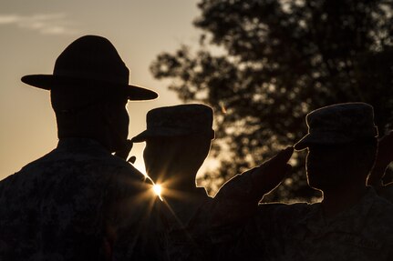 2014 Army Reserve Drill Sergeant of the Year Staff Sgt. Christopher Croslin brings a group of Army Reserve Soldiers to present arms during reveille at Fort McCoy, Wis., June 19, 2015. (U.S. Army photo by Sgt. 1st Class Brian Hamilton)