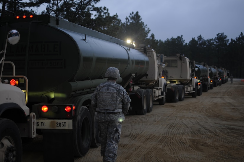 Staff Sgt. James Hardin, a motor transport operator with the 705th Transportation Company, inspects vehicle placards prior to the departure of a petroleum supply convoy during the Quartermaster Liquid Logistics Exercise (QLLEX) at Fort Bragg, N.C., June 12, 2015. QLLEX is an exercise allowing Army Reserve units to train delivering fuel and water at the tactical, operational and strategic levels. (Sgt. Christopher Bigelow / Released)