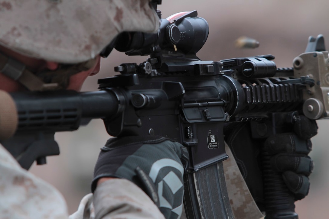 Lance Cpl. Justin Ezell, a Marine with 2nd Battalion, 1st Marine Division, I Marine Expeditionary Force, shoots at his target during Special Operations Training Group’s Raid Leaders Course aboard Marine Corps Base Camp Pendleton, Calif., June 9, 2015. The two-week long course focuses on preparing Marines to conduct combat raids. (Photo by LCpl. Danielle Rodrigues/Released)